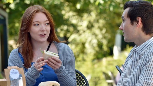 Visitors sat outside the cafe at Gibside